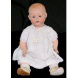 A GERMAN BISQUE HEADED DREAM BABY DOLL, THE ARMAND MARSEILLE HEAD WITH BLUE GLASS EYES AND OPEN