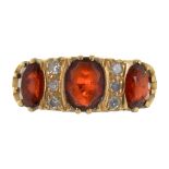 A GARNET AND DIAMOND RING IN 18CT GOLD, MAKER'S MARK IL & CO, LONDON 1964, 7.9G, SIZE O++GOOD