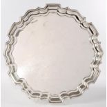 A GEORGE V SILVER SALVER ON THREE LEAF CAPPED FEET, 31CM D, SHEFFIELD 1931, 26OZS