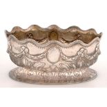 A VICTORIAN OVAL SILVER BOWL, WITH UNDULATING GADROONED RIM, THE SIDES EMBOSSED WITH SWAGS AND