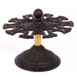 VICTORIAN OFFICE EQUIPMENT. AN ORNATE VICTORIAN CA\ST IRON DESK STAMP-STAND, WITH BRASS SLEEVED