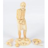 A JAPANESE CARVED SECTIONAL IVORY FIGURE OF A MAN, 19CM H, MEIJI PERIOD