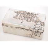 A CHINESE SILVER CIGARETTE BOX, THE LID DECORATED IN RELIEF WITH FLOWERS ON A STIPPLED GROUND, CEDAR