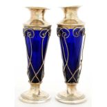A PAIR OF EDWARD VII BLUE GLASS BODIED SILVER VASES OF FLARED SHAPE WITH WAISTED NECK, 17.5CM H,