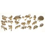 NINETEEN ELIZABETH II MINIATURE CAST SILVER ANIMALS, INCLUDING HEDGEHOG, PIG, DONKEY, HORSE AND