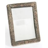 A SOUTH EAST ASIAN SILVER AND SILVER COLOURED METAL STRUT FRAME, ADAPTED AS A MIRROR, WITH