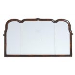 A WALNUT OVERMANTEL MIRROR IN GEORGE II STYLE, EARLY 20TH C, with moulded frame and three bevelled