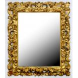 A 19TH C CARVED AND GILDED WOOD MIRROR WITH BEVELLED PLATE, EARLY 20TH C, 78 X 63CM