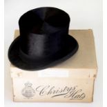 A SILK TOP HAT IN A CARDBOARD BOX MARKED CHRISTIES HATS LONDON