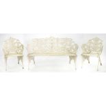 A FERN AND BLACKBERRY PATTERN PAINTED ALLOY GARDEN SEAT AND PAIR OF CHAIRS, IN VICTORIAN STYLE,