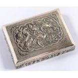 A MIDDLE EASTERN RECTANGULAR SILVER REPOUSSÉ CIGARETTE BOX, THE LID CRISPLY DECORATED WITH BIRDS,