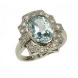 AN AQUAMARINE AND DIAMOND CLUSTER RING the oval aquamarine approx 10 x 12mm, in platinum, Convention