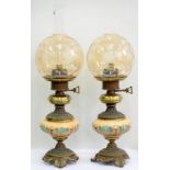 A PAIR OF VICTORIAN STYLE BRASS MOUNTED POTTERY LAMPS, WITH GLASS GLOBES, 48CM H EXCLUDING