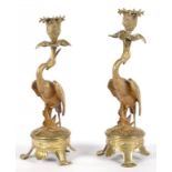 A PAIR OF 19TH C NATURALISTIC BRASS STORK CANDLESTICKS, WITH LEAFY SCONCE, NOZZLE AND DRIP PAN, ON