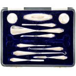 A GEORGE V ELEVEN PIECE SILVER MANICURE SET, BIRMINGHAM 1915, CASED