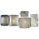 THREE GEORGE V SILVER CIGARETTE CASES, 8.5CM AND CIRCA, BIRMINGHAM 1933 AND CIRCA, A SILVER VESTA