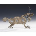 A CHINESE SILVER ARTICULATED MODEL OF A DRAGON, C1900 with blue glass eyes, 14cm h , 6ozsProvenance: