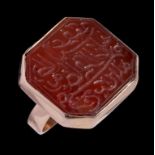 A GOLD RING MOUNTED WITH AN ARABIC CORNELIAN CALLIGRAPHIC SEAL, 19TH C OR EARLIER THE RING LATER