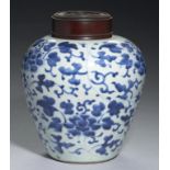 A CHINESE BLUE AND WHITE JAR, QING DYNASTY, 18TH C painted with lotus meander, the rim of the neck