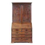 A GEORGE III MAHOGANY BUREAU CABINET, C1780 the cabinet with blind fret carved frieze above panelled