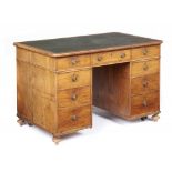 A VICTORIAN WALNUT DESK, C1840 with panelled front and fitted nine drawers, 73cm h; 68 x 114cm,