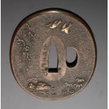 A SENTOKU TSUBA, LATE EDO PERIOD, EARLY 19TH C decorated with designs of swallows in flight, plum