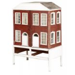 A VICTORIAN WOODEN DOLLS HOUSE the two door facade with twin panelled front doors and fenestration