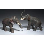 A PAIR OF JAPANESE BRONZE SCULPTURES OF ELEPHANTS, MEIJI PERIOD rich dark patina, red in places (