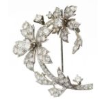 CARTIER. A DIAMOND FLOWER BROOCH diamonds weighing in total approx 3ct, in white gold, 45mm,
