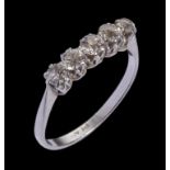 A DIAMOND FIVE STONE RING set with graduated round brilliant cut diamonds, in platinum, marked PLAT,