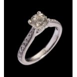 A DIAMOND RING the central round brilliant cut diamond weighing approx 0.8ct the shoulders with