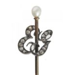 A VICTORIAN GOLD STICKPIN the terminal as the initials EG picked out in rose diamonds, 67mm, 1.6g,