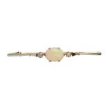 AN OPAL AND DIAMOND BAR BROOCH, C 1930 in platinum and gold, 70mm l, marked PLAT 18ct, 6.25g++Good