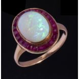 AN OPAL AND RUBY CLUSTER RING in gold, unmarked, 3.75g, size M++Opal is slightly loose in setting,