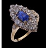 A SAPPHIRE AND DIAMOND CLUSTER RING the central oval sapphire weighing approx 1ct surrounded by