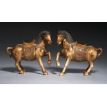 A PAIR OF CHINESE CARVED, STAINED AND JEWELLED IVORY MODELS OF SADDLED HORSES, C1900 the trappings