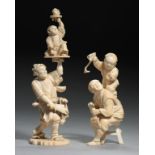 TWO JAPANESE IVORY OKIMONOS, MEIJI PERIOD one of an entertainer and boy raised aloft with a koma, 15