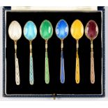 A SET OF SIX ELIZABETH II SILVER GILT AND HARLEQUIN GUILLOCHE ENAMEL COFFEE SPOONS, BIRMINGHAM 1966,