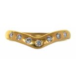 A SEVEN STONE GYPSY SET DIAMOND RING IN 18CT GOLD, 3.1G, SIZE I ++GOOD CONDITION