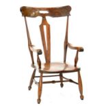 A STAINED BEECH ELBOW CHAIR IN AN ARTS AND CRAFTS STYLE