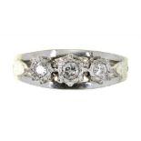 A THREE STONE DIAMOND RING IN WHITE GOLD, WEIGHING APPROX 0.35CT IN TOTAL, MARKED 18CT, 4G, SIZE