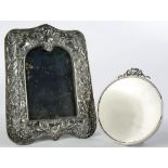 AN EDWARD VII SILVER PHOTOGRAPH FRAME, 23CM H, BIRMINGHAM 1906 AND A CIRCULAR SILVER PHOTOGRAPH