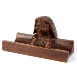 A SWISS CARVED AND STAINED WOOD LIMEWOOD DOG'S HEAD NOVELTY INKWELL, 18CM L, LATE 19TH C