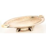 AN ART DECO IVORY HANDLED SILVER FRUIT BOWL ON FOUR OPEN WEDGE SHAPED FEET, 26.5CM L, SHEFFIELD