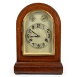 A GERMAN MAHOGANY MANTEL CLOCK, WITH BEVELLED GLASS INSET DOOR, THE MOVEMENT CHIMING ON ROD GONGS,