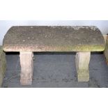 A RECONSTITUTED STONE GARDEN BENCH