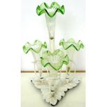 A LATE VICTORIAN EPNS FLOWER STAND WITH FOUR DETACHABLE GREEN SHADED GLASS TRUMPET VASES ON