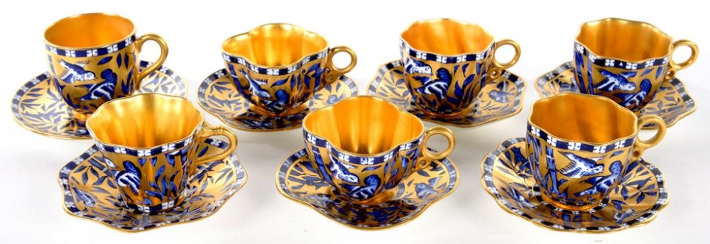 SEVEN COALPORT GILT GROUND JAPANESE GROVE PATTERN COFFEE CUPS AND SAUCERS, VARIOUS SIZES, PRINTED