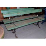 A PAIR OF EARLY 20TH C CAST IRON AND TIMBER PLATFORM TYPE WITH HINGED BACK RESTS, LATER PAINTED