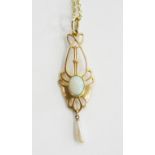 BY B. H. JOSEPH AND CO. AN ART NOUVEAU OPAL, BAROQUE PEARL AND GOLD OPENWORK PENDANT, C1905, 42MM,